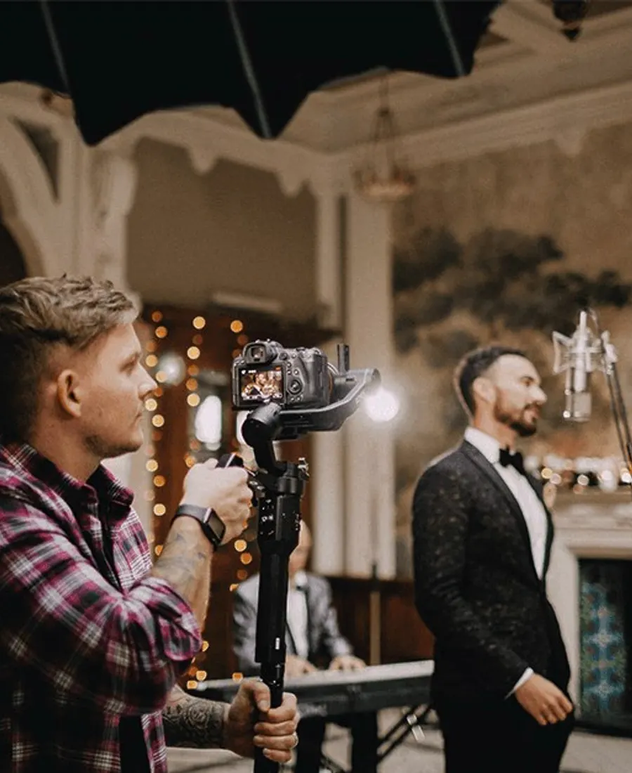 Wedding filmmaker capturing a ceremony